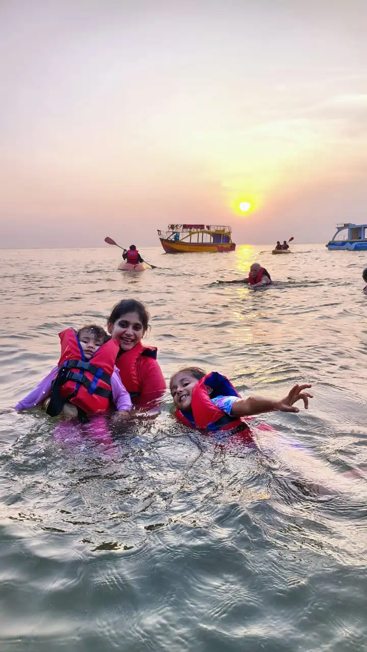 Relaxing sunset swim during the boat tour Sunset swimming experience in Gokarna beach